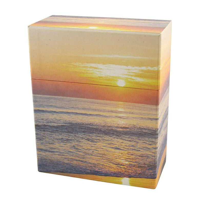 Rectangular box with a sunset over water design on a white background